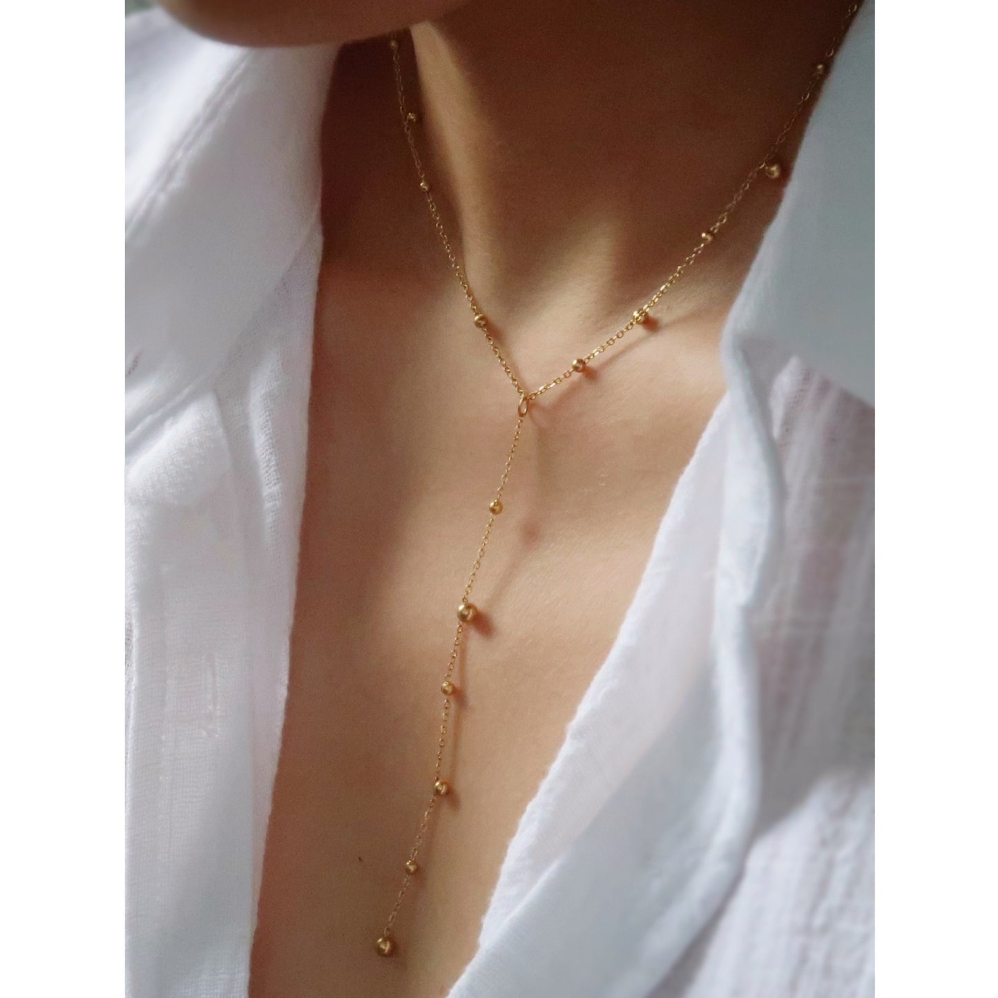 Y-shaped Necklace With A Tassel Pendant And Round Beads